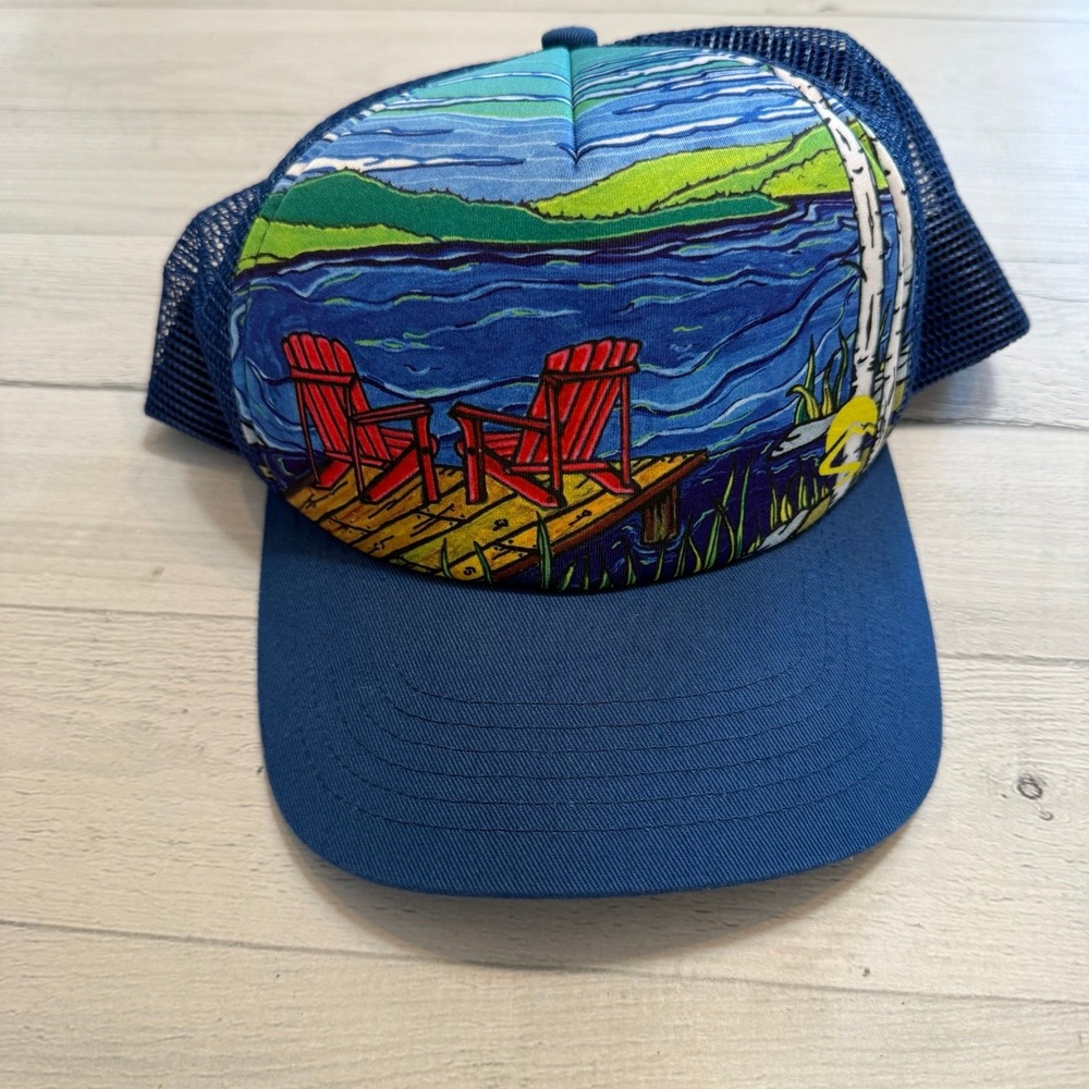 Sunday afternoons Artist Series lake with patio chairs unisex hat